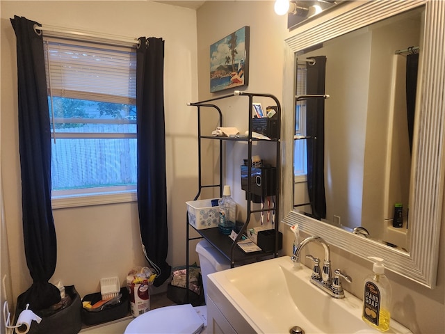 bathroom featuring vanity and toilet