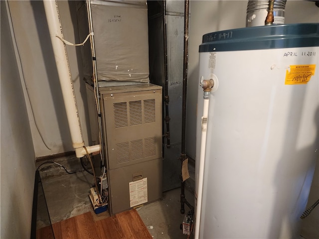 utility room with gas water heater