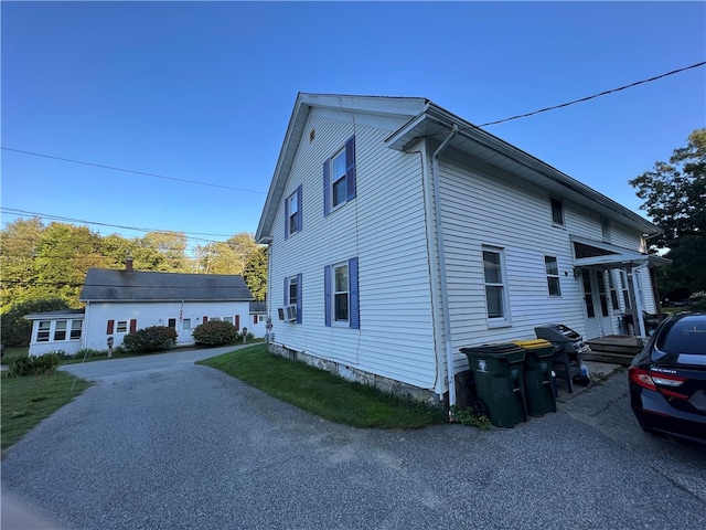 view of property exterior with cooling unit