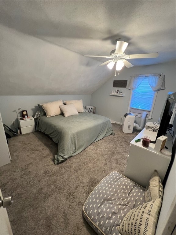 bedroom featuring carpet floors, a textured ceiling, vaulted ceiling, and ceiling fan