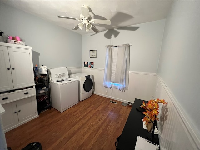 laundry area featuring ceiling fan, washing machine and dryer, and dark hardwood / wood-style floors