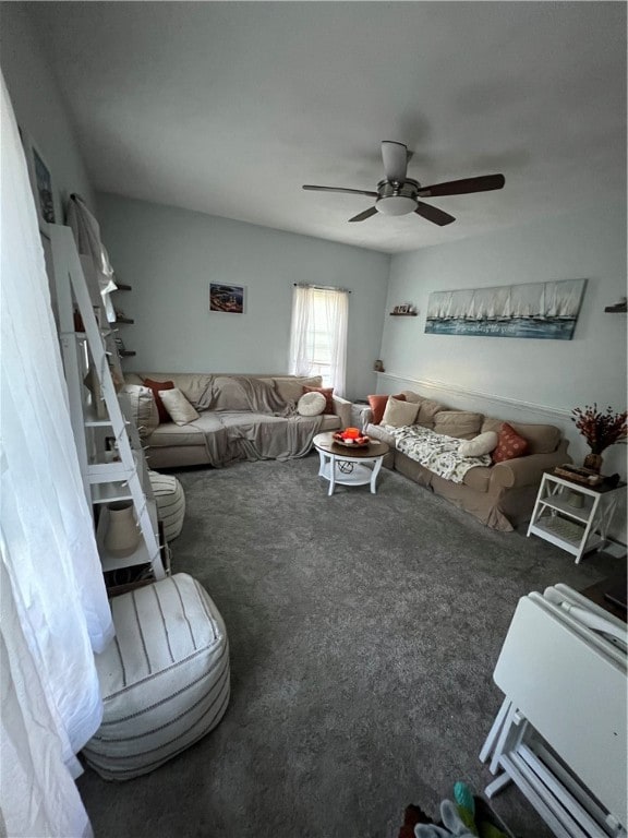 living room with dark colored carpet and ceiling fan