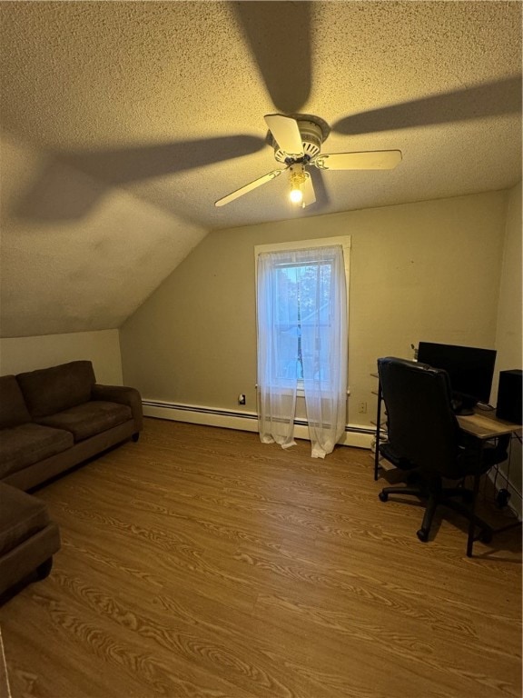 office area featuring lofted ceiling, a textured ceiling, hardwood / wood-style flooring, and ceiling fan