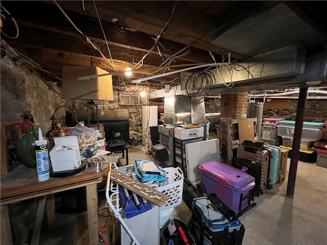 basement with white refrigerator