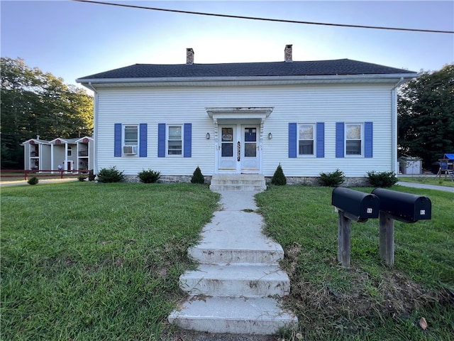 view of front of home with a front yard