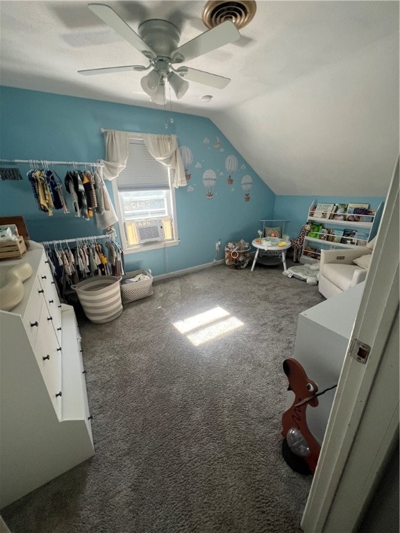 bedroom with ceiling fan, carpet flooring, and lofted ceiling