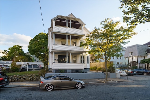 view of front of house with a balcony