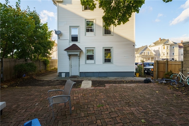 back of property featuring a patio area