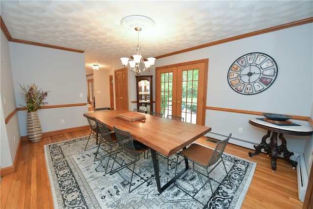 dining area featuring french doors, light hardwood / wood-style flooring, crown molding, an inviting chandelier, and a baseboard radiator