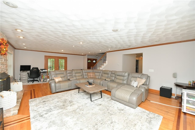 living room featuring crown molding, french doors, and wood-type flooring