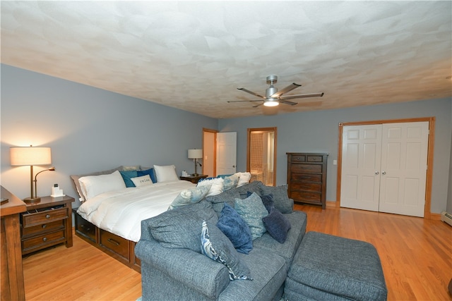 bedroom featuring light hardwood / wood-style flooring and ceiling fan