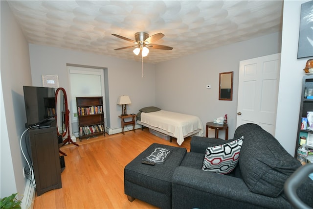 bedroom with hardwood / wood-style flooring and ceiling fan