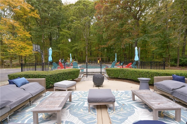 view of patio / terrace with a fenced in pool and a playground