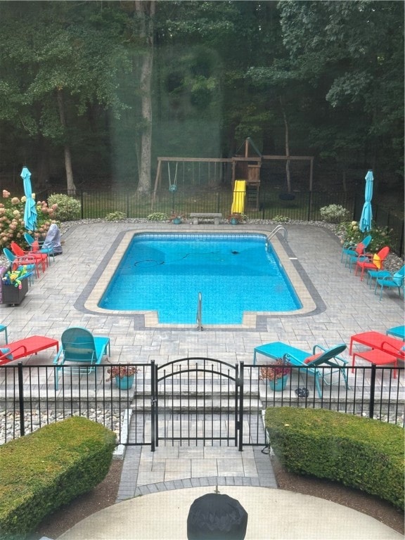 view of pool featuring a patio