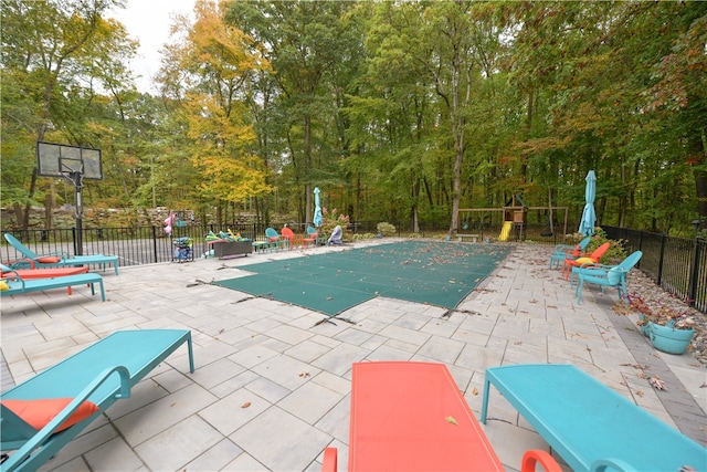 view of swimming pool featuring a patio area