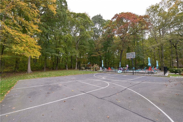 view of sport court with a playground