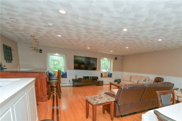 living room featuring light hardwood / wood-style floors and a baseboard radiator