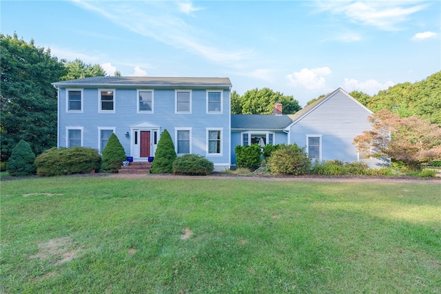 colonial-style house with a front yard