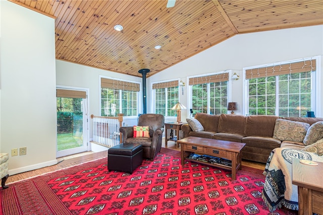 living room with wooden ceiling, a wealth of natural light, lofted ceiling, and wood-type flooring