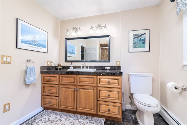 bathroom with toilet, vanity, baseboard heating, and walk in shower