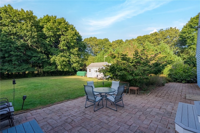 view of patio / terrace featuring a storage unit