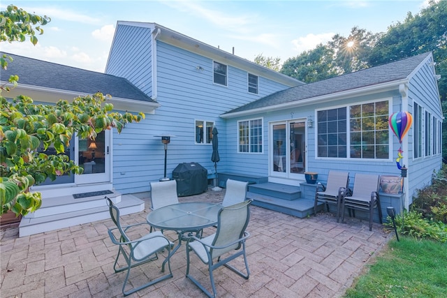 back of property with a patio area