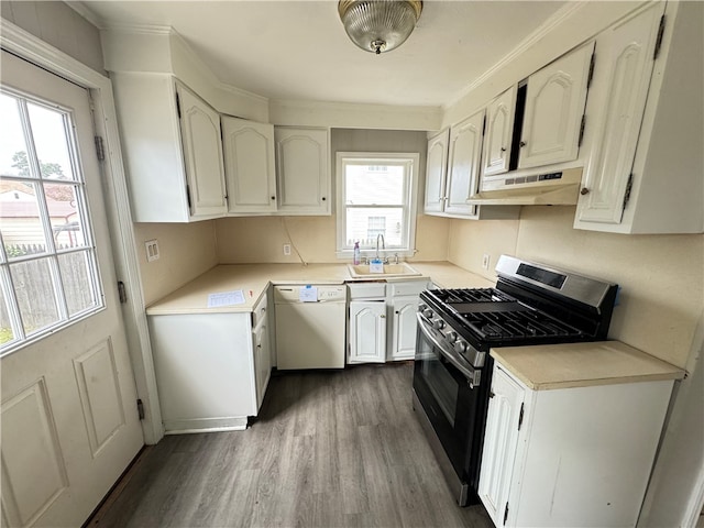 kitchen with exhaust hood, dark hardwood / wood-style flooring, gas range, dishwasher, and sink