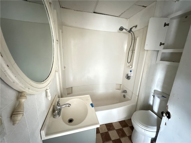 full bathroom featuring vanity, shower / washtub combination, and toilet