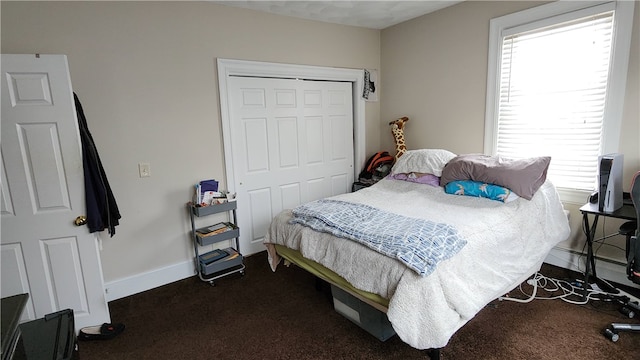 carpeted bedroom featuring a closet