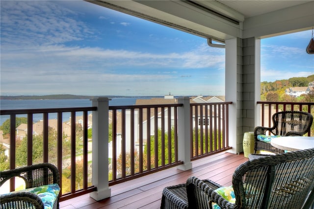 balcony featuring a water view