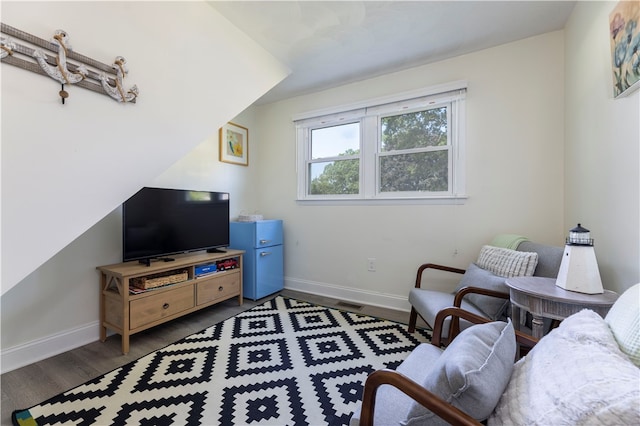 living room featuring dark wood-type flooring