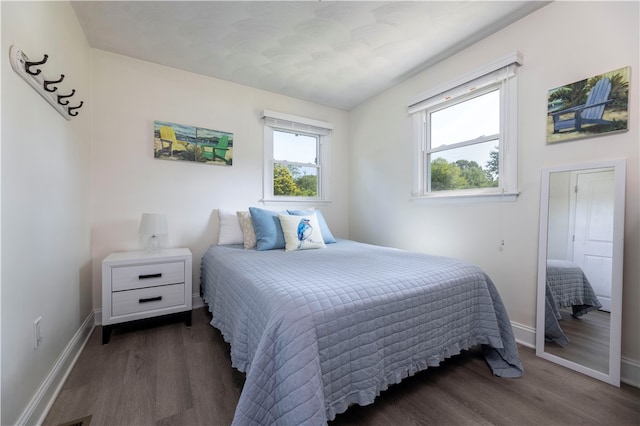 bedroom featuring dark hardwood / wood-style floors