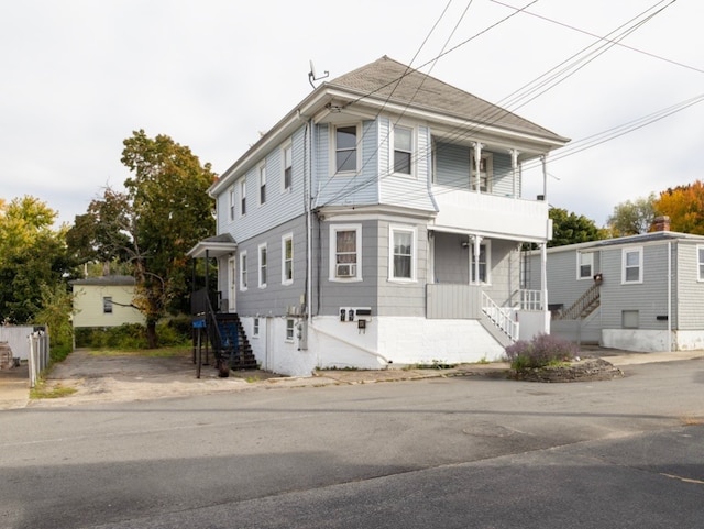 view of front of home with a balcony