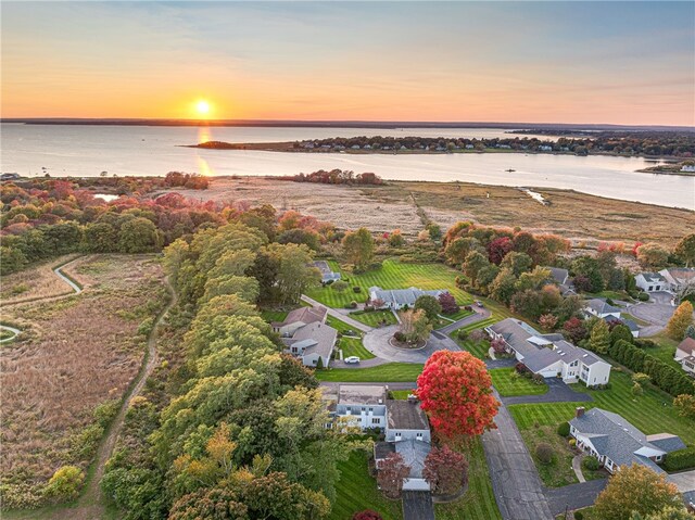 aerial view at dusk with a water view