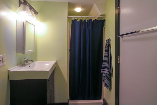 bathroom with vanity and a shower with curtain