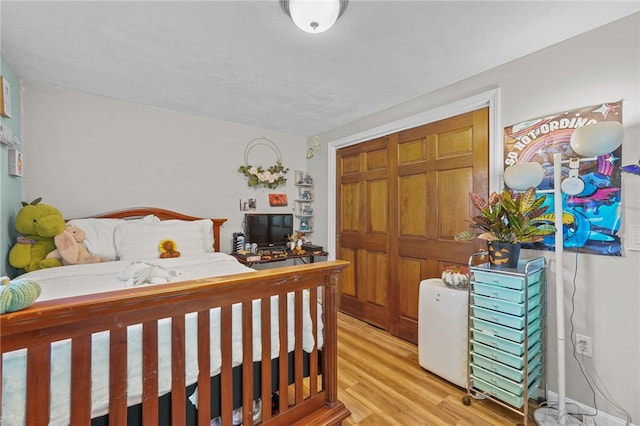 bedroom with light hardwood / wood-style floors