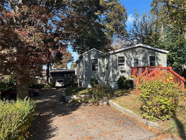 view of front of property featuring a wooden deck