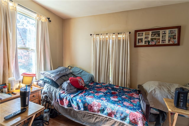 bedroom with wood-type flooring