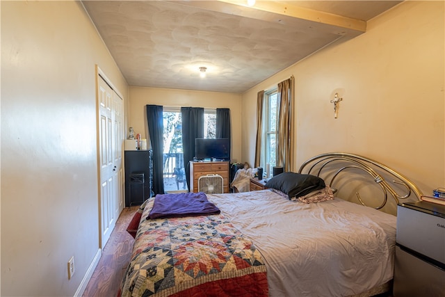 bedroom featuring a closet and hardwood / wood-style flooring