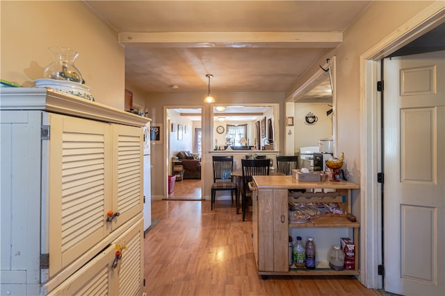 kitchen featuring hanging light fixtures and hardwood / wood-style flooring