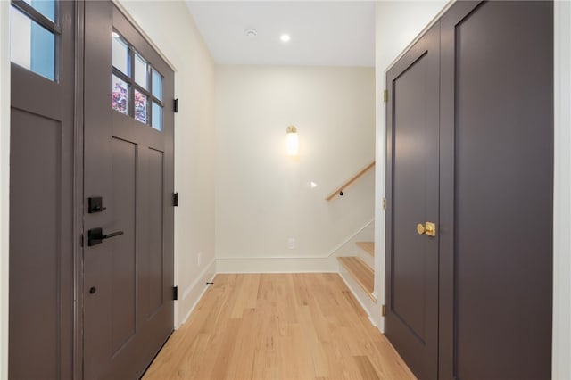 foyer entrance with light hardwood / wood-style flooring