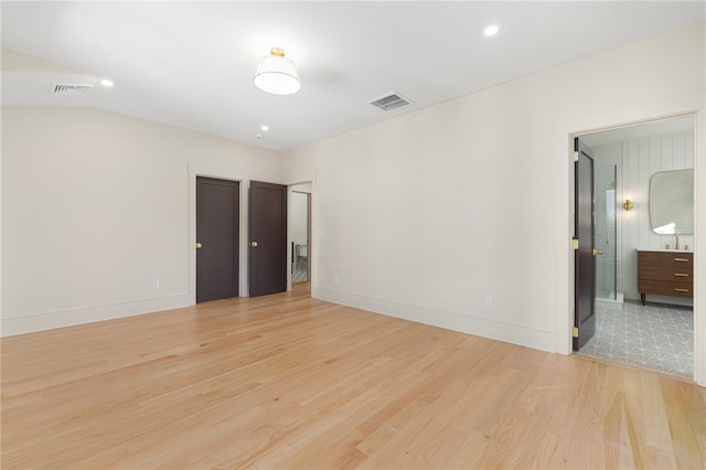 spare room featuring light hardwood / wood-style floors