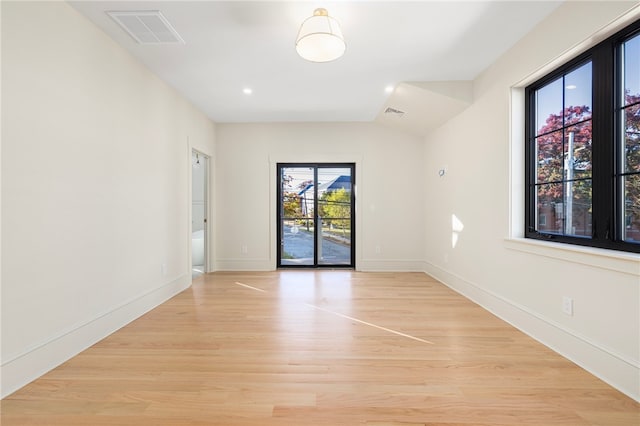 spare room featuring light hardwood / wood-style flooring