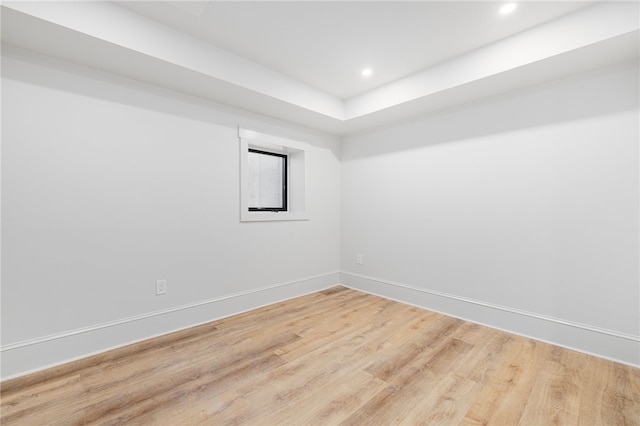 unfurnished room with hardwood / wood-style flooring