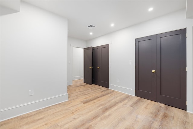 unfurnished bedroom featuring light hardwood / wood-style flooring