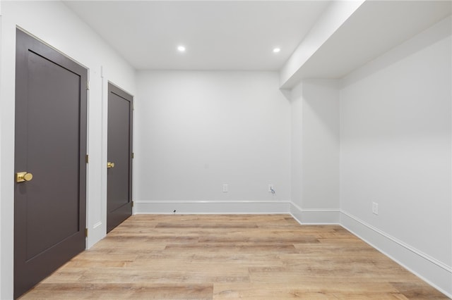 spare room featuring light hardwood / wood-style floors