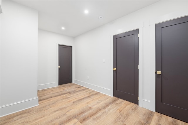 unfurnished room featuring light hardwood / wood-style flooring