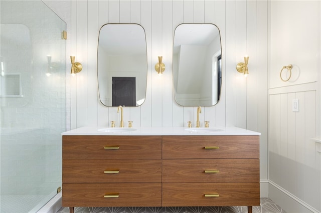 bathroom featuring vanity and a shower with shower door