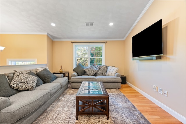 living room featuring crown molding and hardwood / wood-style floors