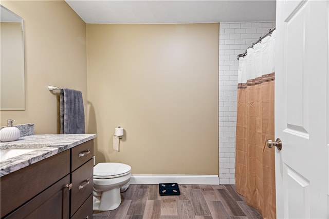 bathroom with vanity, a shower with curtain, wood-type flooring, and toilet